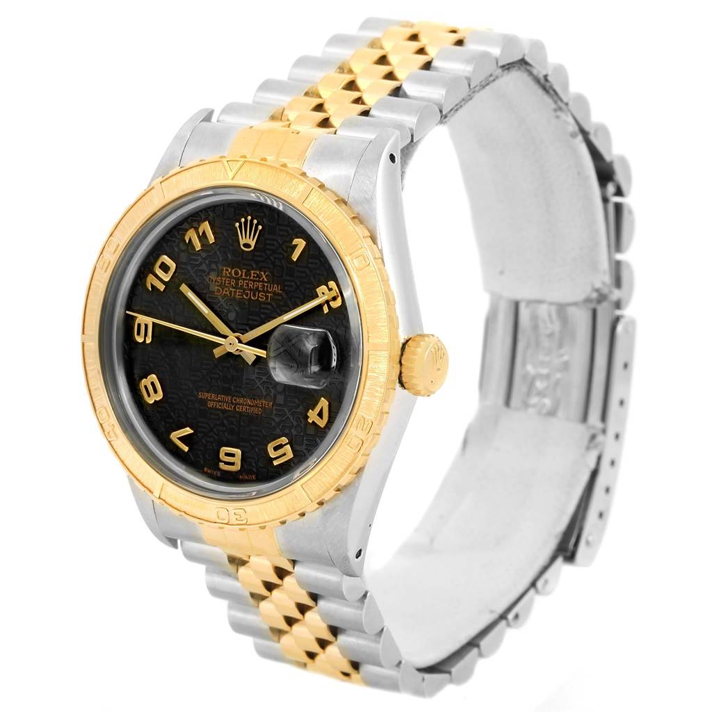 The Rolex Turn-o-Graph 16253 Men's Steel and Gold (two tone) Black Dial 16253 Men's Steel and Gold (two tone) Black Dial watch is shown at a three-quarter angle, highlighting its bezel, dial, and two-tone bracelet.