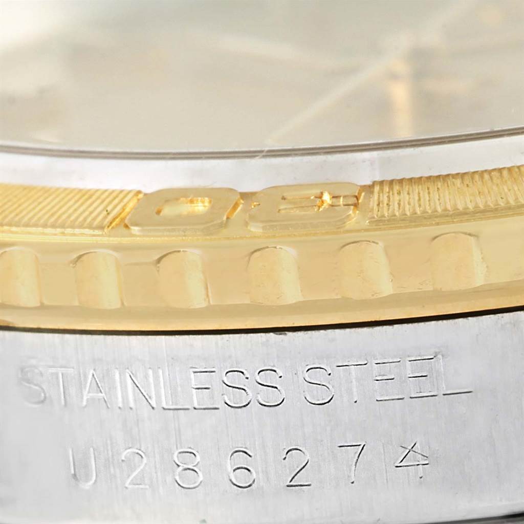 The image shows a close-up of the bezel and part of the case back of a Rolex Turn-o-Graph 16263 Men's Steel and Gold (two tone) Champagne Dial 16263 Men's Steel and Gold (two tone) Champagne Dial watch, with "STAINLESS STEEL" engraved.
