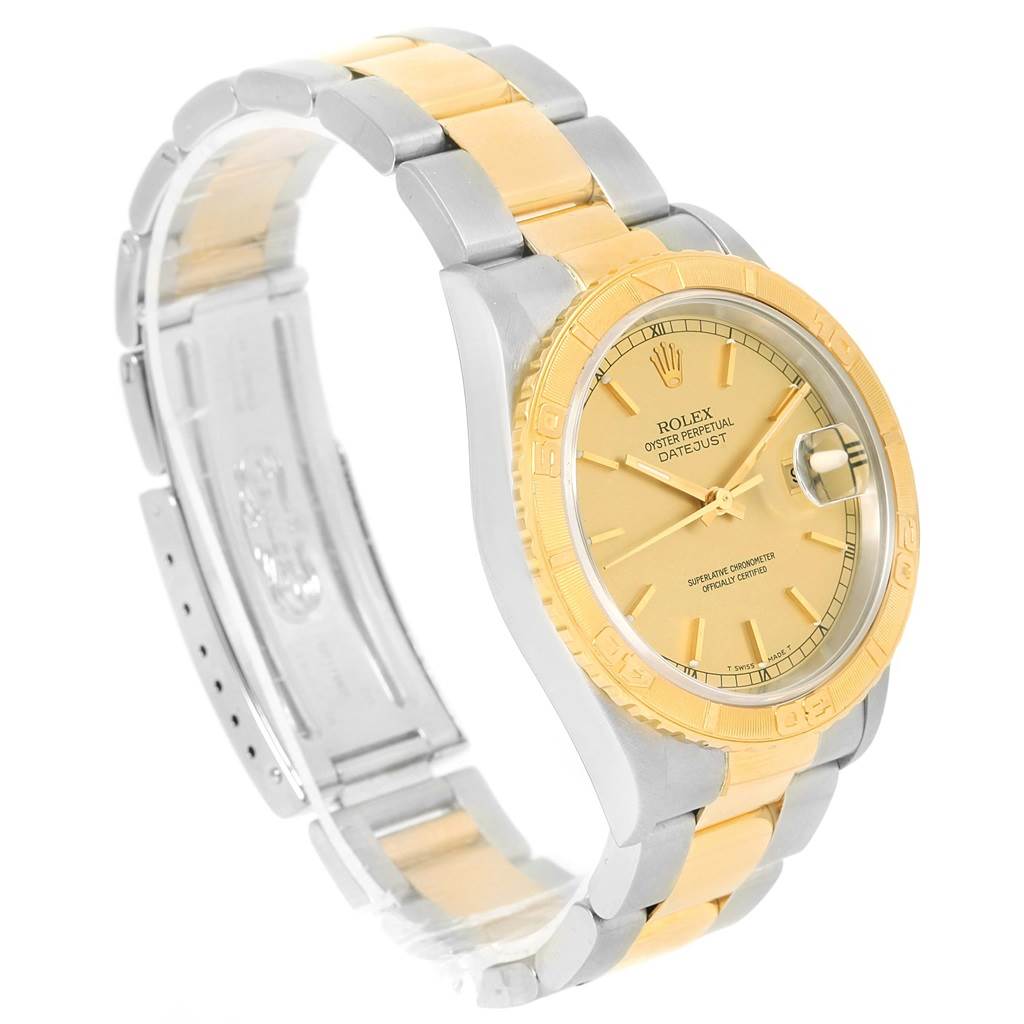 The Rolex Turn-o-Graph 16263 Men's Steel and Gold (two tone) Champagne Dial 16263 Men's Steel and Gold (two tone) Champagne Dial watch is shown at an angled view, highlighting its gold and silver bracelet, bezel, and dial.