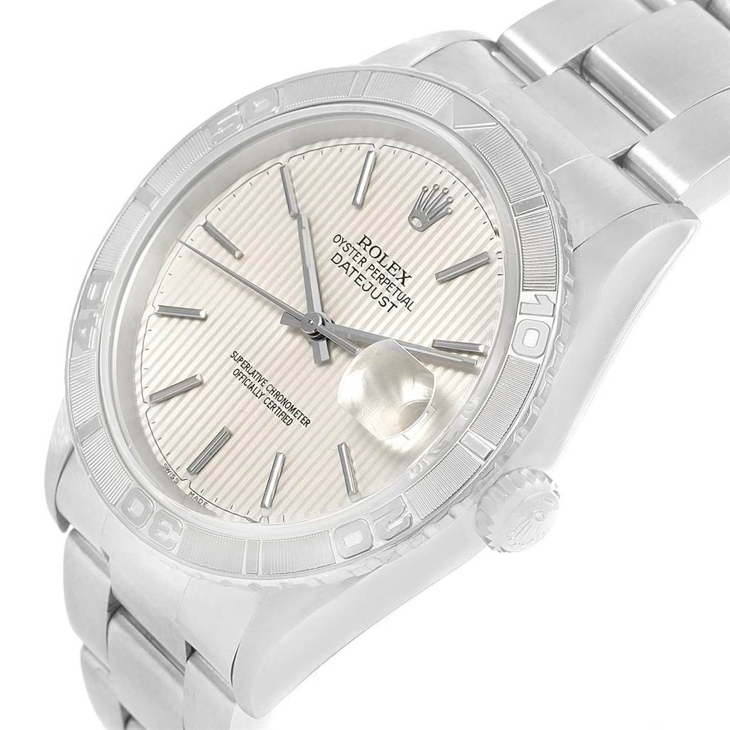 This image shows a close-up angled view of the face, bezel, crown, and part of the bracelet of the Rolex Turn-o-Graph 16264 Men's Stainless Steel Silver Dial 16264 Men's Stainless Steel Silver Dial watch.