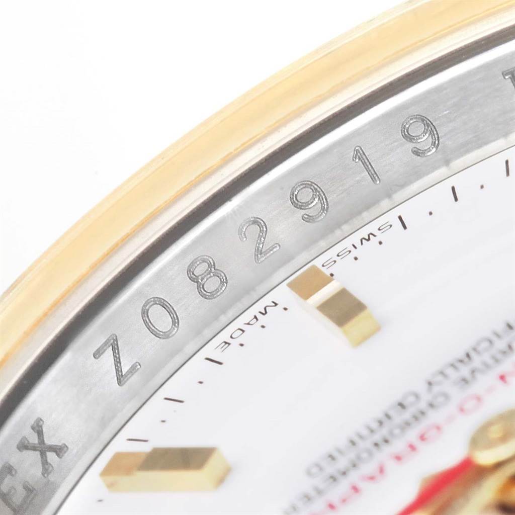 This image shows a close-up of the bezel, part of the dial, and the serial number of the Rolex Turn-o-Graph 116263 Men's Stainless Steel White Dial 116263 Men's Stainless Steel White Dial watch.