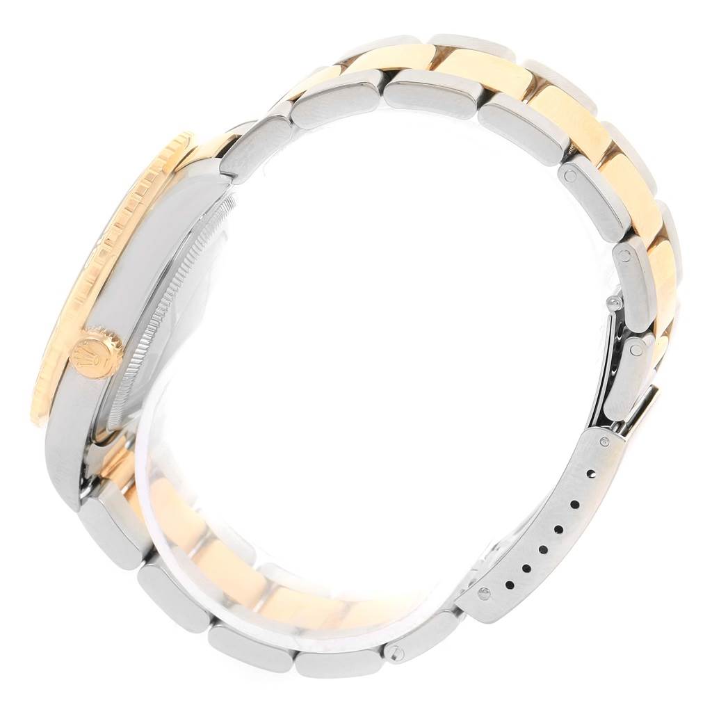 This image shows a Rolex Turn-o-Graph 16263 Men's Steel and Gold (two tone) White Dial 16263 Men's Steel and Gold (two tone) White Dial watch from the side, highlighting its two-tone bracelet and crown.