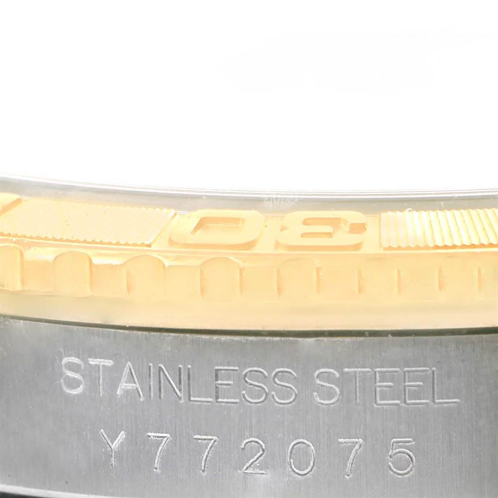 The image shows a close-up of the bezel and the stainless steel case with the serial number of the Rolex Turn-o-Graph 16263 Men's Steel and Gold (two tone) White Dial 16263 Men's Steel and Gold (two tone) White Dial model watch.
