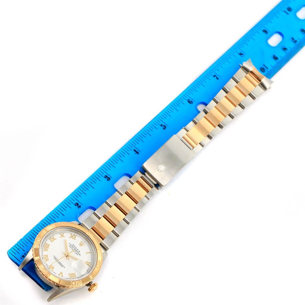 The image shows a Rolex Turn-o-Graph 16263 Men's Steel and Gold (two tone) White Dial 16263 Men's Steel and Gold (two tone) White Dial watch lying flat with a blue ruler, displaying the watch face, bracelet, and clasp.
