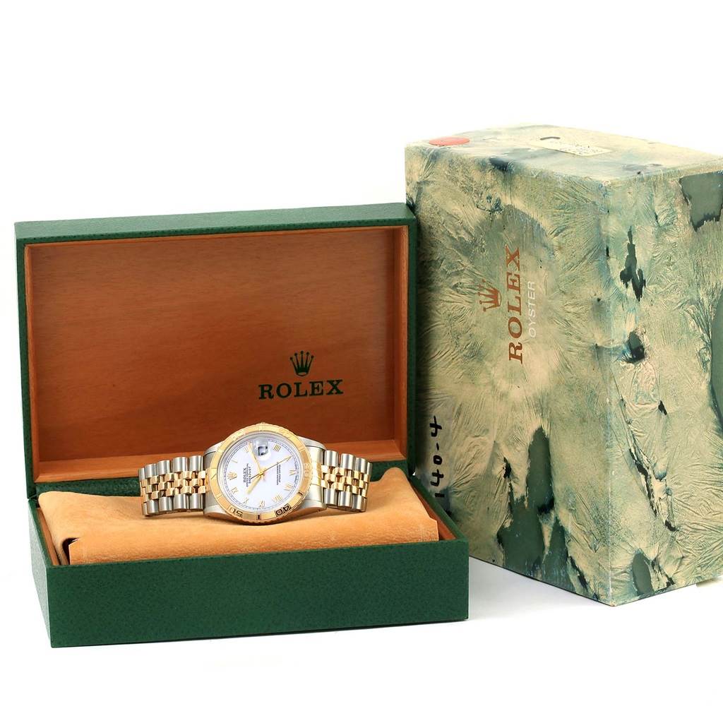 The image shows a Rolex Turn-o-Graph 16263 Men
s Steel and Gold (two tone) White Dial 16263 Men
s Steel and Gold (two tone) White Dial watch in its open green and wooden display box, with the packaging box beside it.