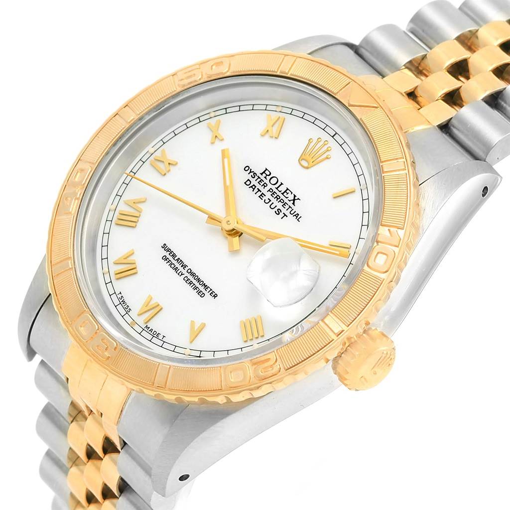 This image shows a Rolex Turn-o-Graph 16263 Men
s Steel and Gold (two tone) White Dial 16263 Men
s Steel and Gold (two tone) White Dial watch at a tilted angle, highlighting its gold bezel, white dial, gold markers, and bi-metallic bracelet.