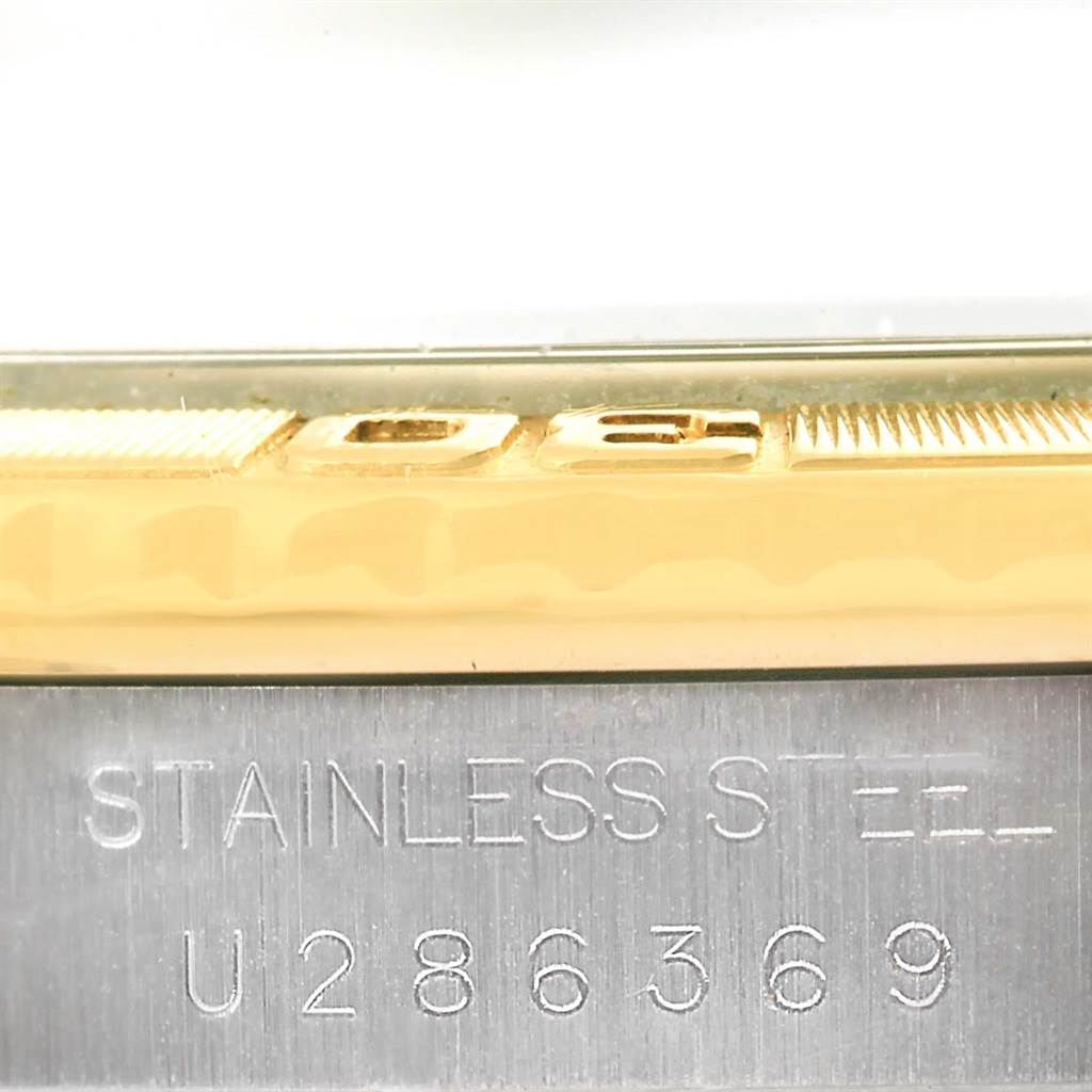 This image shows a close-up of the side engraving and serial number on a Rolex Turn-o-Graph 16263 Men
s Steel and Gold (two tone) Black Dial 16263 Men
s Steel and Gold (two tone) Black Dial watch.