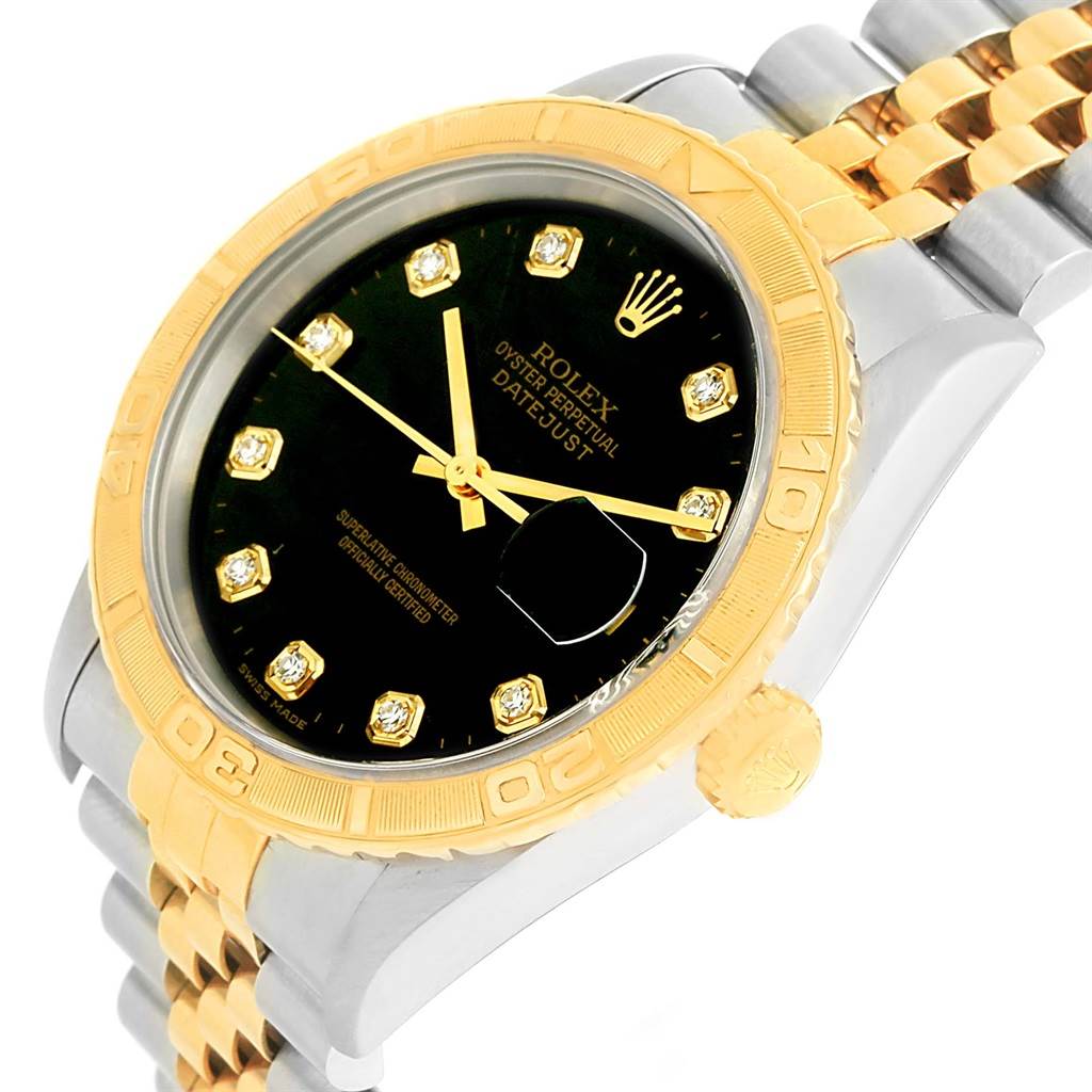 The image shows a close-up angle of a Rolex Turn-o-Graph 16263 Men
s Steel and Gold (two tone) Black Dial 16263 Men
s Steel and Gold (two tone) Black Dial watch focusing on the bezel, dial, and part of the bracelet.