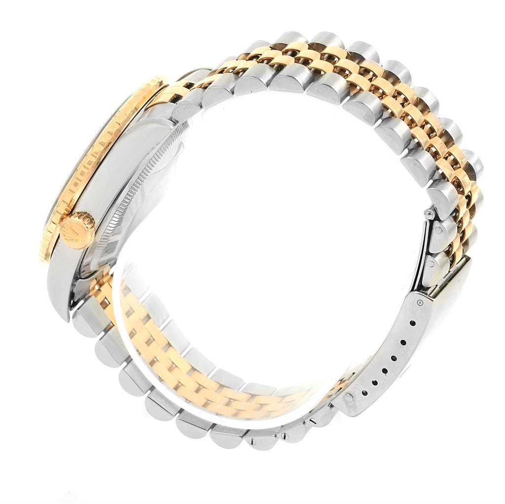 The image shows a side angle of the Rolex Turn-o-Graph 16263 Men
s Steel and Gold (two tone) Black Dial 16263 Men
s Steel and Gold (two tone) Black Dial watch displaying the gold bezel, crown, and two-tone metal bracelet.