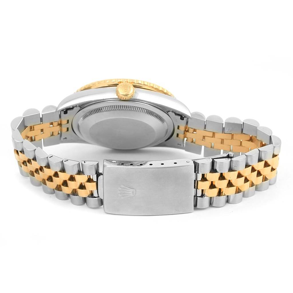 The image shows the back view of a Rolex Turn-o-Graph 16263 Men
s Steel and Gold (two tone) Black Dial 16263 Men
s Steel and Gold (two tone) Black Dial watch, displaying its clasp and partial bracelet.