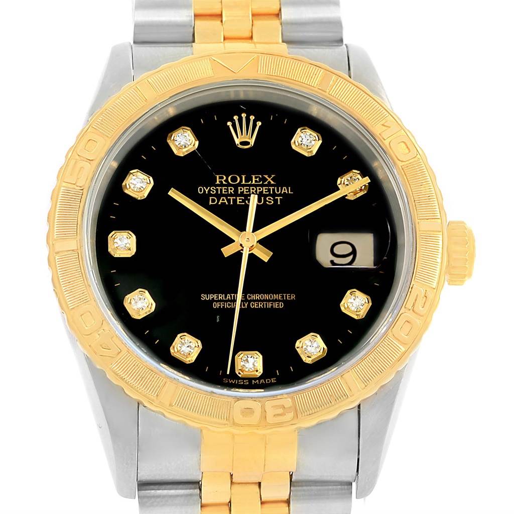 The image shows a front view of the Rolex Turn-o-Graph 16263 Men
s Steel and Gold (two tone) Black Dial 16263 Men
s Steel and Gold (two tone) Black Dial watch, highlighting the bezel, dial, hands, date window, and part of the bracelet.