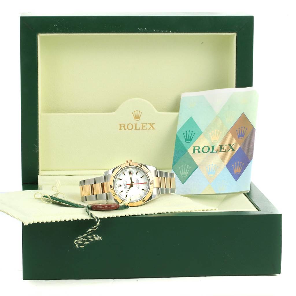 The image shows a Rolex Turn-o-Graph 116263 Men
s Stainless Steel White Dial 116263 Men
s Stainless Steel White Dial watch placed inside its open green box with accompanying booklets and tags.
