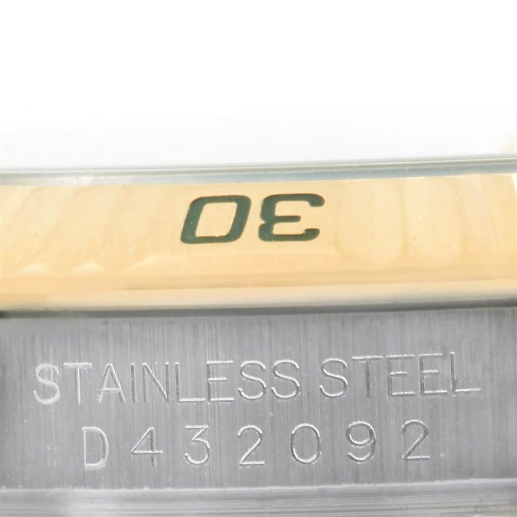 The image shows a close-up of the bezel and case of a Rolex Turn-o-Graph 116263 Men
s Stainless Steel White Dial 116263 Men
s Stainless Steel White Dial watch, highlighting the "30" marker and "Stainless Steel" engraving.