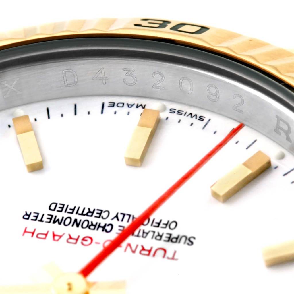 Close-up of a Rolex Turn-o-Graph 116263 Men
s Stainless Steel White Dial 116263 Men
s Stainless Steel White Dial watch showing part of the dial, hour markers, and bezel with the serial number.