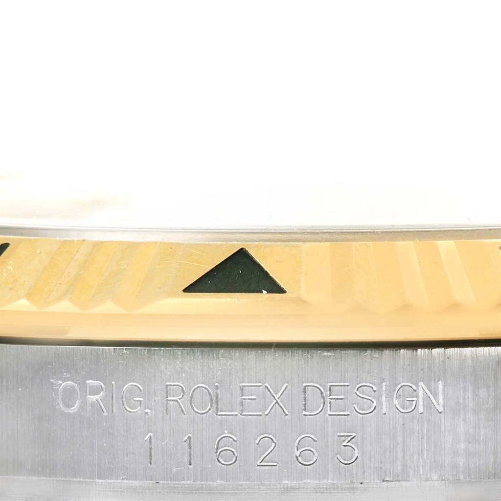 This image shows a close-up of the bezel and engraved case side of the Rolex Turn-o-Graph 116263 Men's Stainless Steel Champagne Dial 116263 Men's Stainless Steel Champagne Dial watch, model number 116263.