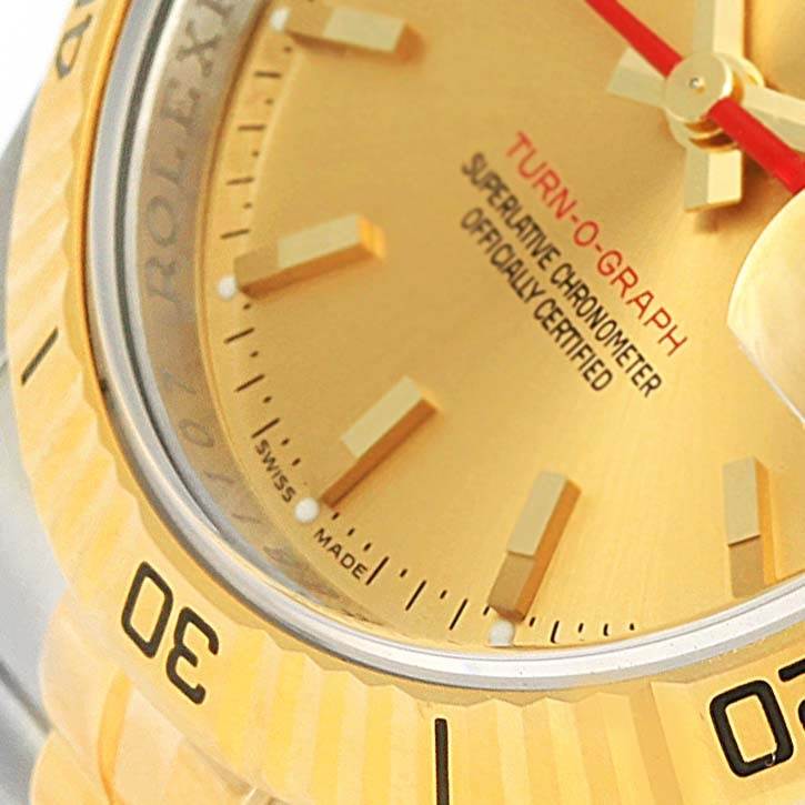 The image shows a close-up of the dial and bezel of a Rolex Turn-o-Graph 116263 Men's Stainless Steel Champagne Dial 116263 Men's Stainless Steel Champagne Dial watch from an angled side view.