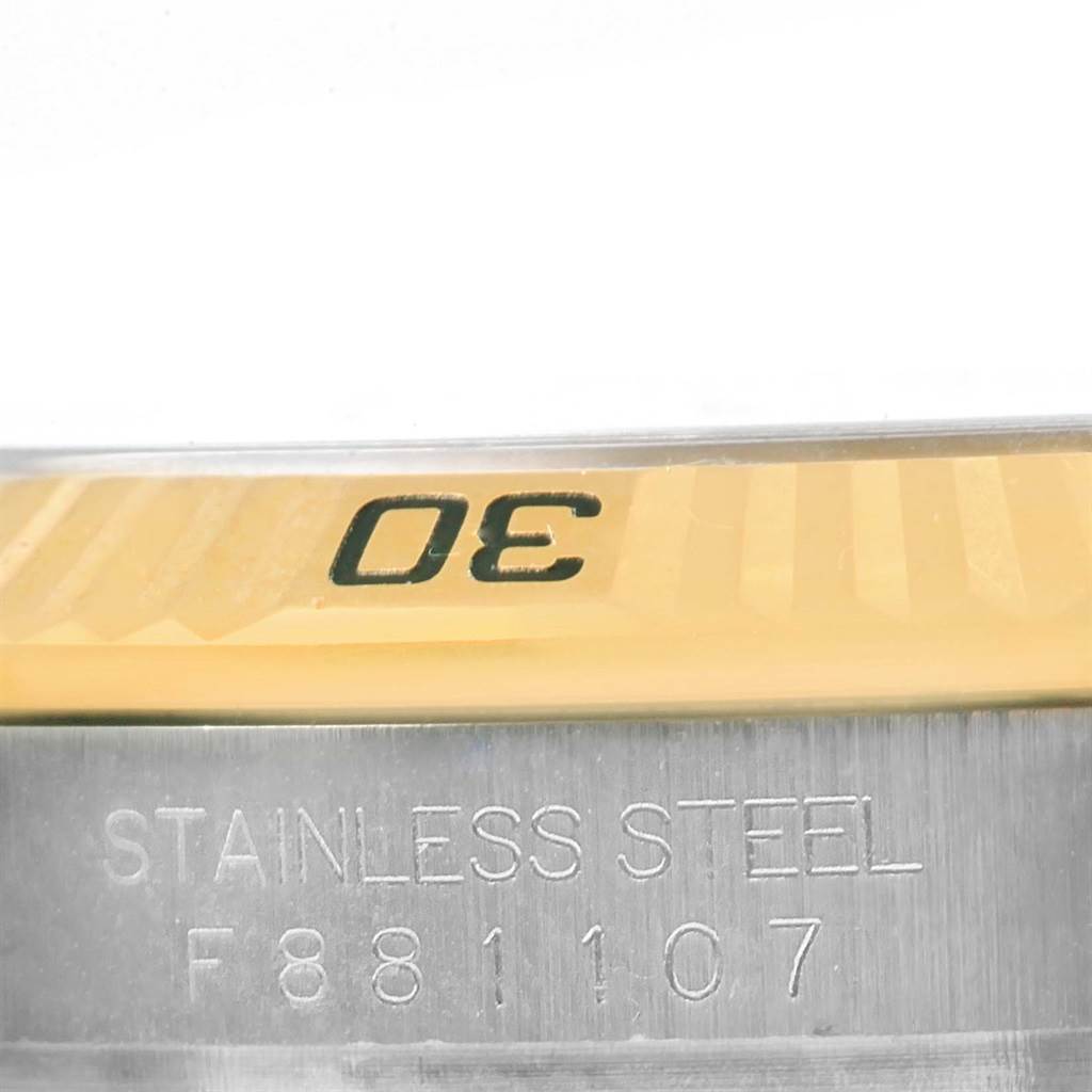 This image shows the bezel and part of the case back of the Rolex Turn-o-Graph 116263 Men's Stainless Steel Champagne Dial 116263 Men's Stainless Steel Champagne Dial watch, including the serial number.