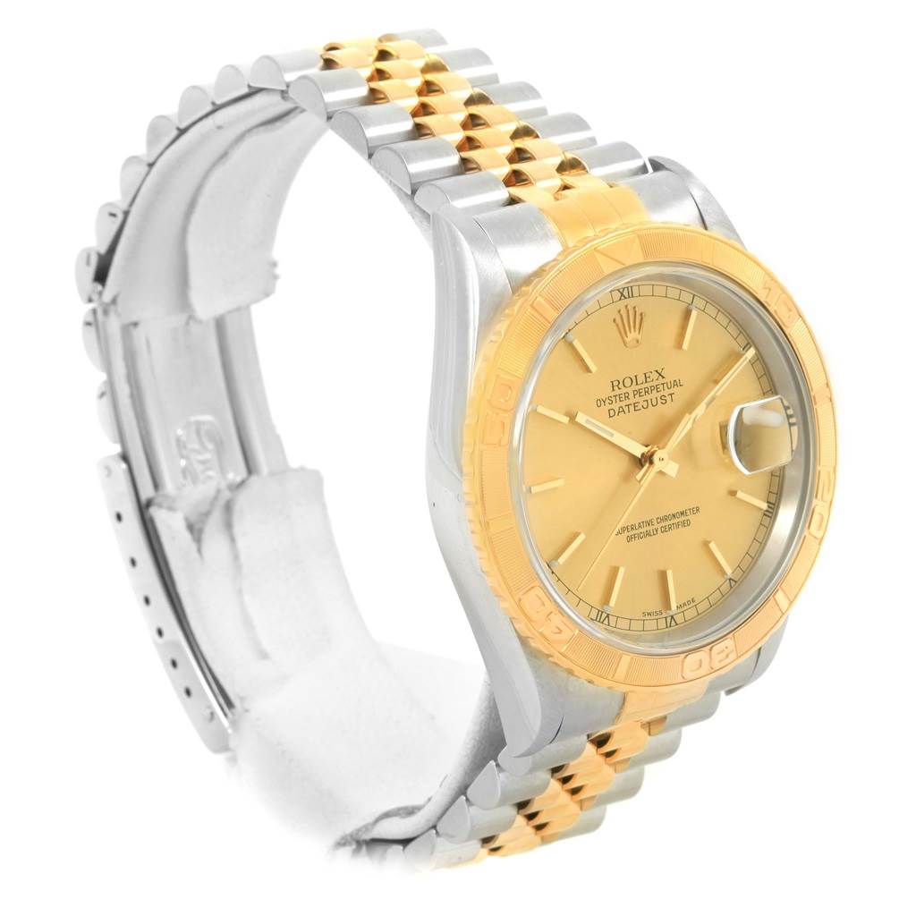 The image shows a side-angle view of a two-tone Rolex Turn-o-Graph 16263 Men
s Steel and Gold (two tone) Champagne Dial 16263 Men
s Steel and Gold (two tone) Champagne Dial watch, highlighting its gold bezel, dial, and Jubilee bracelet.
