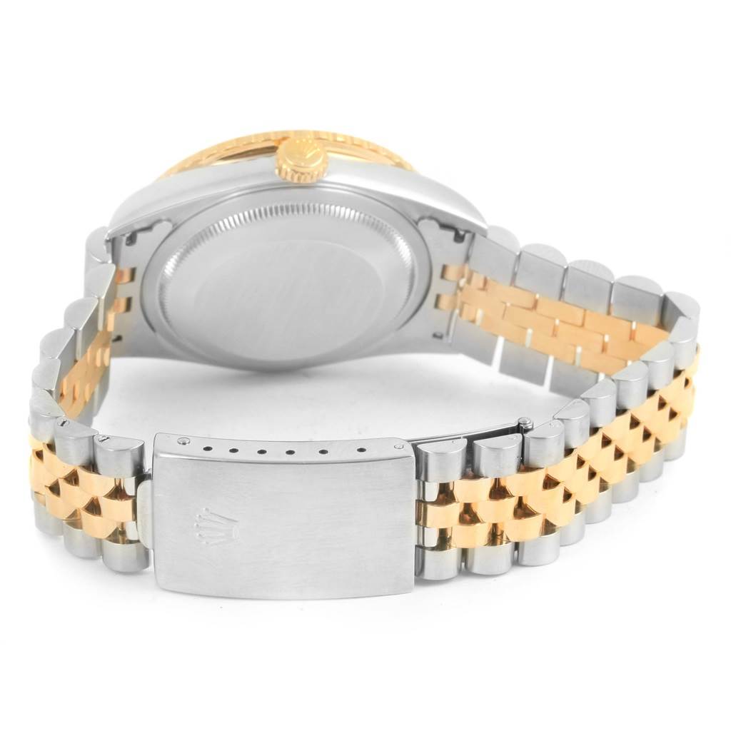 This is a rear view of a Rolex Turn-o-Graph 16263 Men
s Steel and Gold (two tone) Champagne Dial 16263 Men
s Steel and Gold (two tone) Champagne Dial watch showing its case back, crown, and two-tone metal bracelet.