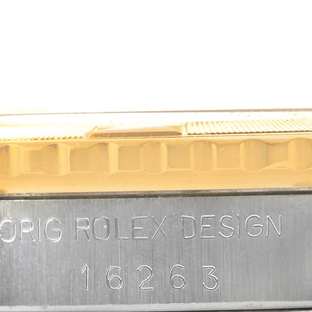 The image shows a close-up of the side view of a Rolex Turn-o-Graph 16263 Men
s Steel and Gold (two tone) Champagne Dial 16263 Men
s Steel and Gold (two tone) Champagne Dial, focusing on the bezel and engraved model number 16263.