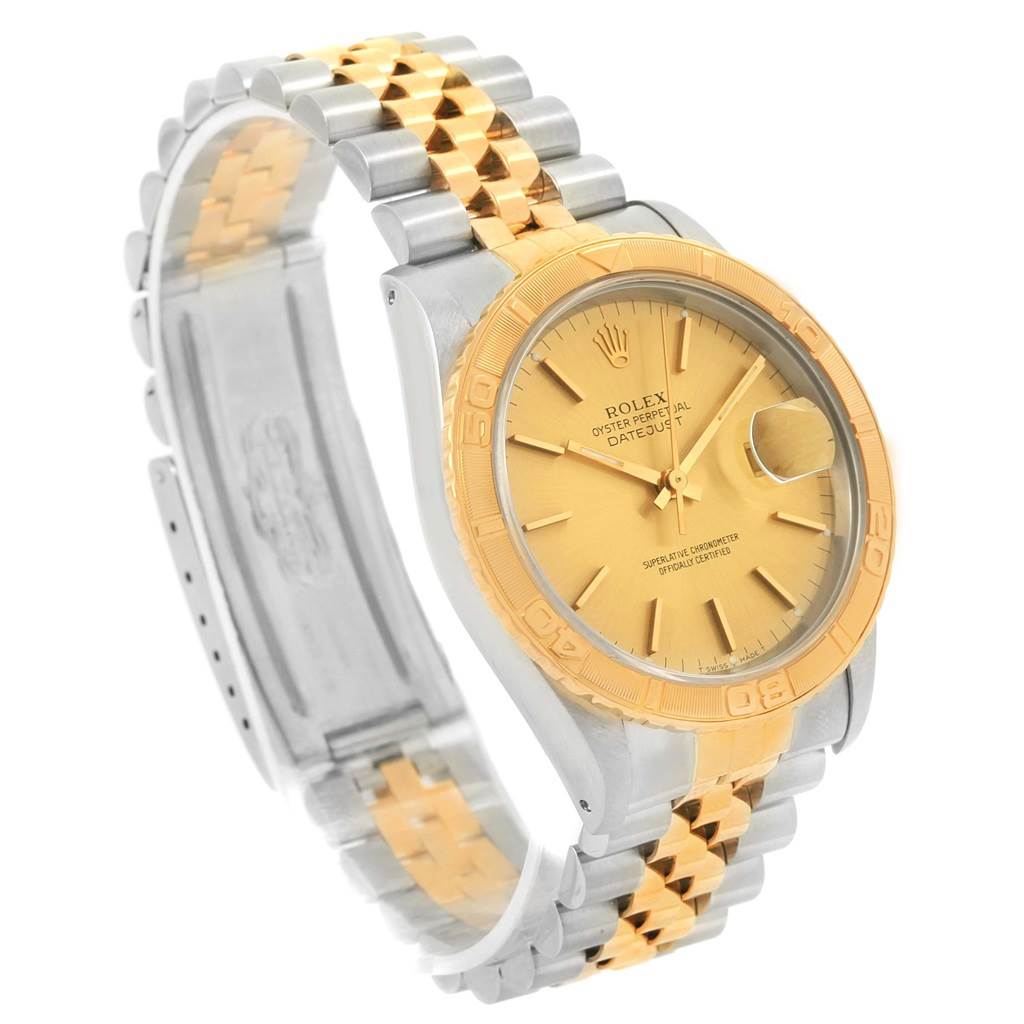 This image shows a Rolex Turn-o-Graph 16263 Men
s Steel and Gold (two tone) Champagne Dial 16263 Men
s Steel and Gold (two tone) Champagne Dial watch at a slight angle, highlighting its two-tone bracelet and gold face.