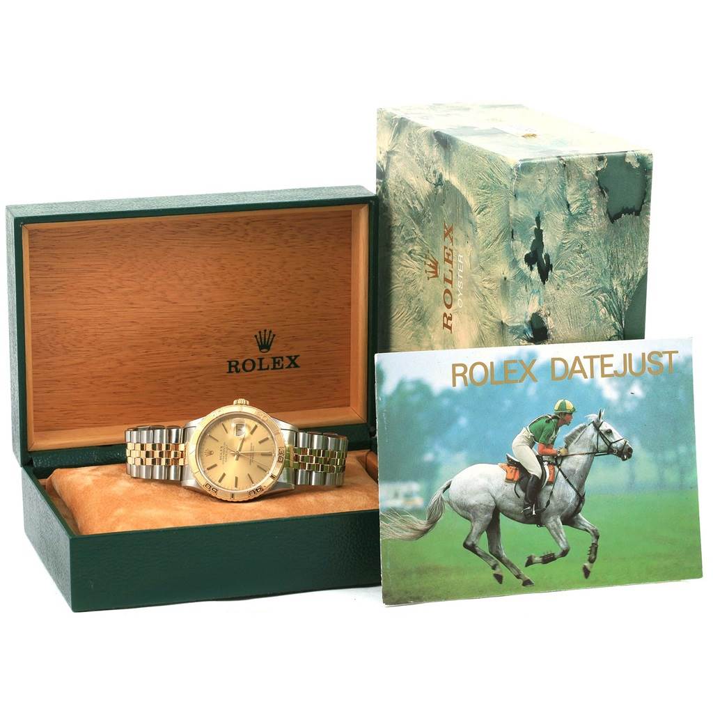 The image shows a Rolex Turn-o-Graph 16263 Men
s Steel and Gold (two tone) Champagne Dial 16263 Men
s Steel and Gold (two tone) Champagne Dial watch in its open box, alongside its outer box and an accompanying booklet.