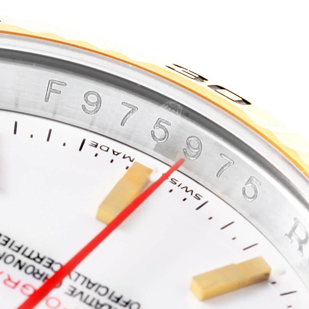 This close-up image of the Rolex Turn-o-Graph 116263 Men's Stainless Steel White Dial 116263 Men's Stainless Steel White Dial watch shows part of the dial, the 'Swiss Made' text, the serial number, and a portion of the bezel.