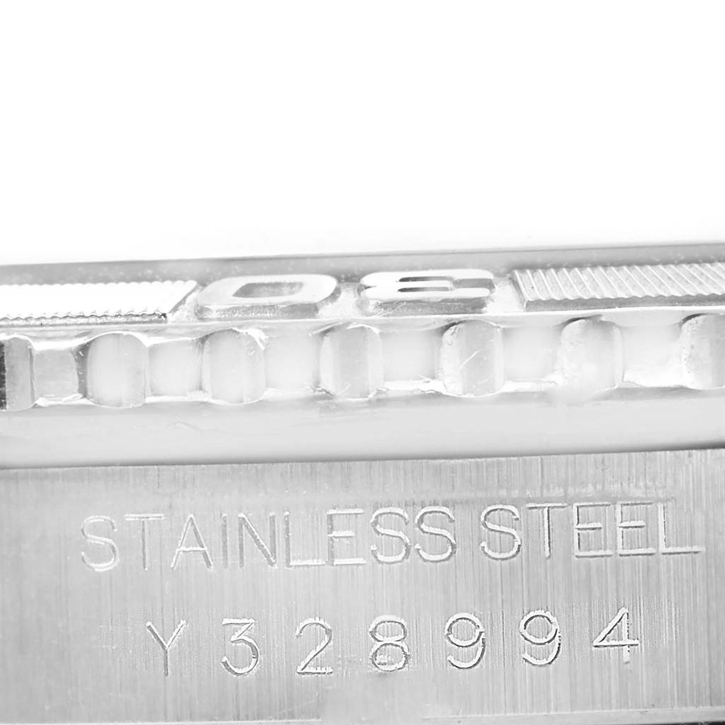 The image shows a close-up view of the bezel and serial number of the Rolex Turn-o-Graph 16264 Men's Stainless Steel Black Dial 16264 Men's Stainless Steel Black Dial watch.