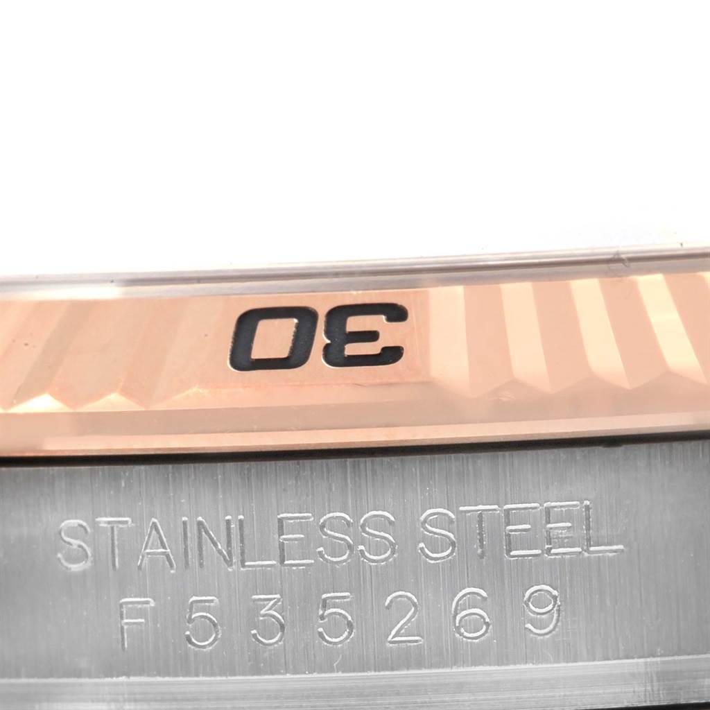 The image shows a close-up of the bezel and caseback with serial number engraving of a Rolex Turn-o-Graph 116261 Men's Stainless Steel White Dial 116261 Men's Stainless Steel White Dial watch.