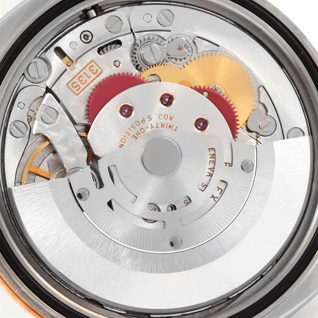 The image shows a close-up view of the internal movement mechanics of a Rolex Turn-o-Graph 116261 Men's Stainless Steel Black Dial 116261 Men's Stainless Steel Black Dial watch.