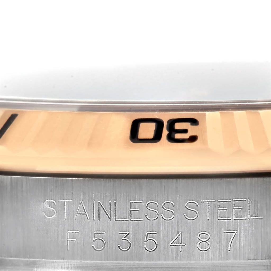 This image shows a close-up view of the bezel and case edge of a Rolex Turn-o-Graph 116261 Men's Stainless Steel Black Dial 116261 Men's Stainless Steel Black Dial watch, highlighting the "30" marker and stainless steel inscription with serial number.