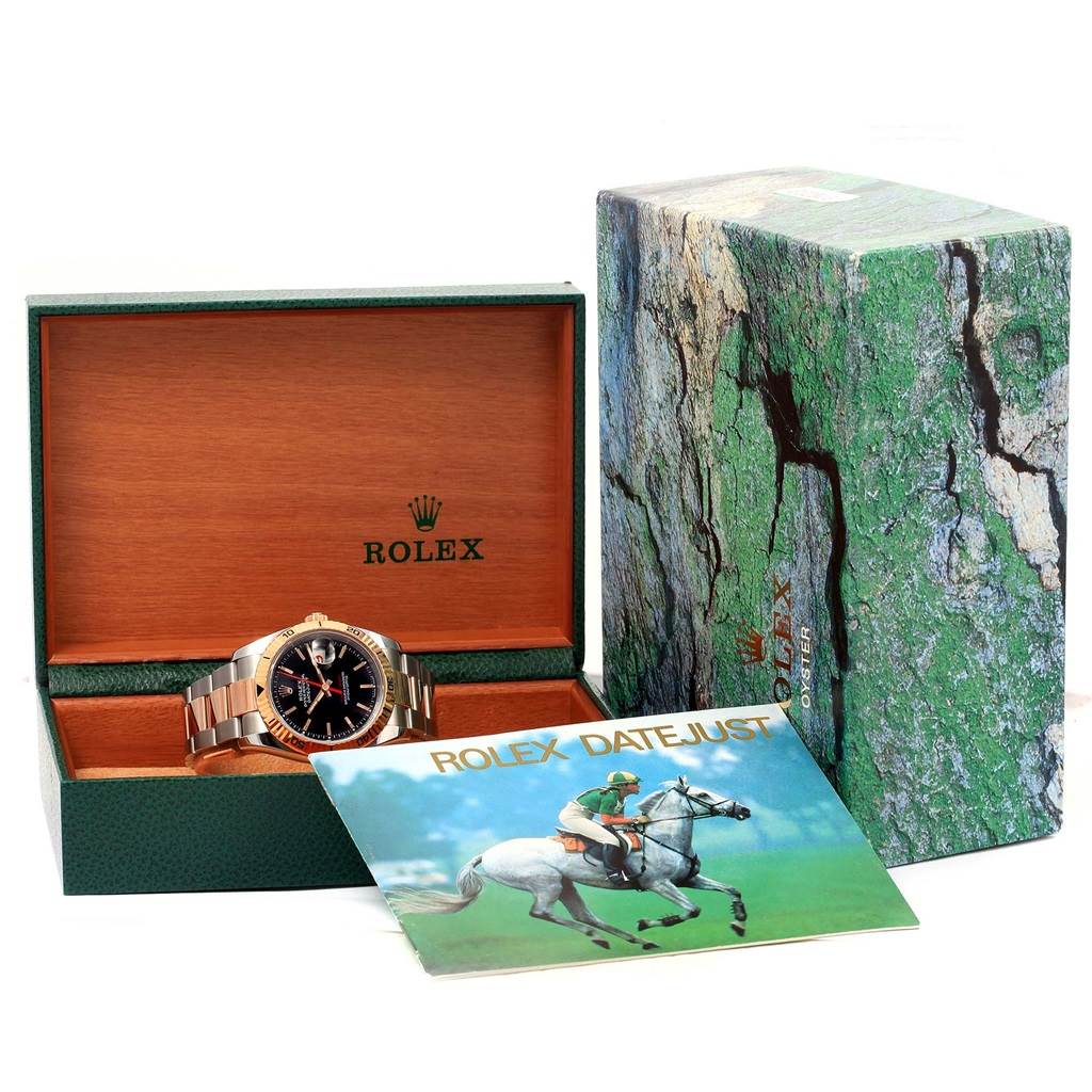 The image shows a Rolex Turn-o-Graph 116261 Men's Stainless Steel Black Dial 116261 Men's Stainless Steel Black Dial watch in its open box with associated packaging and a booklet displayed in front.