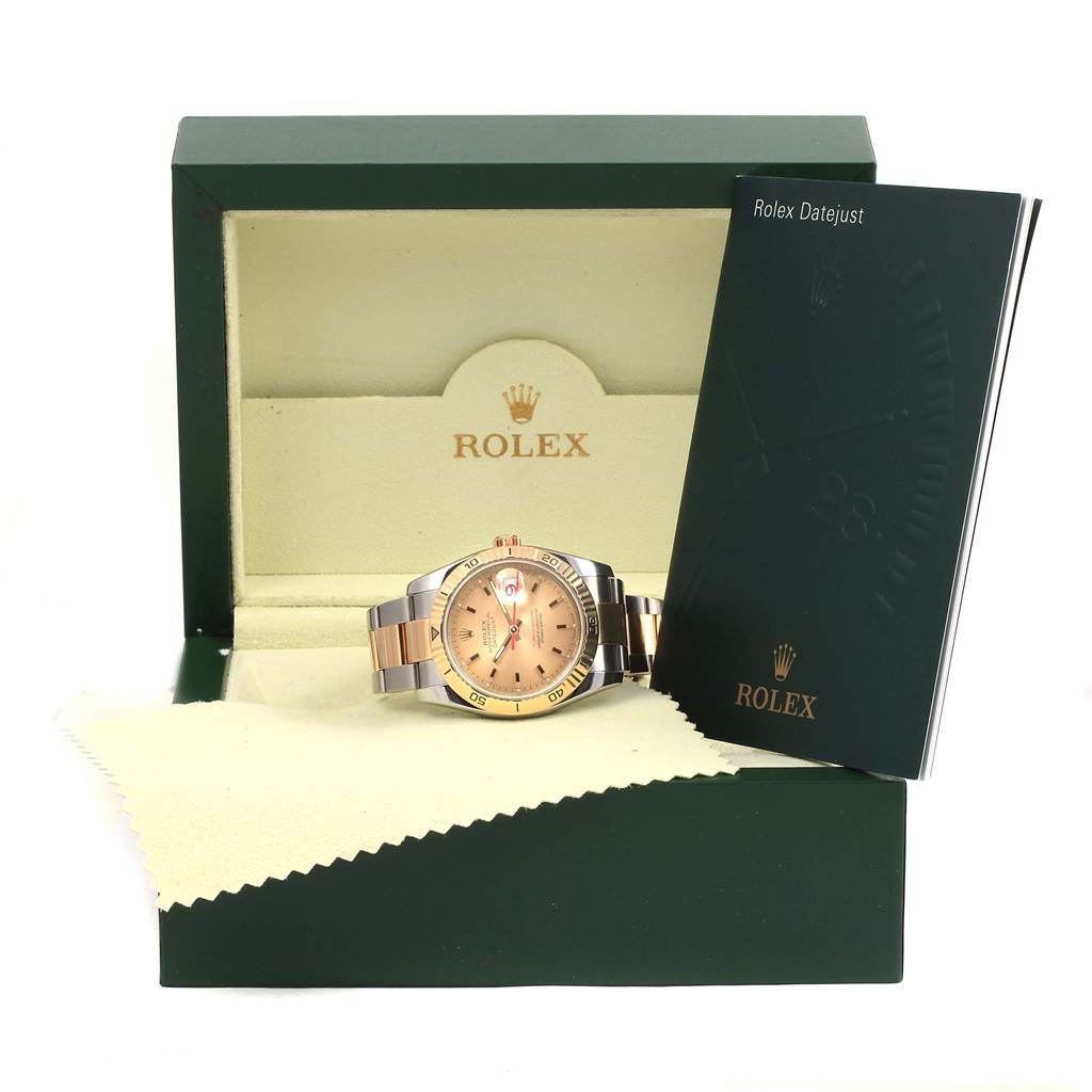 The image shows a Rolex Turn-o-Graph 116263 Men
s Stainless Steel Champagne Dial 116263 Men
s Stainless Steel Champagne Dial watch displayed in its open green box with a manual beside it.