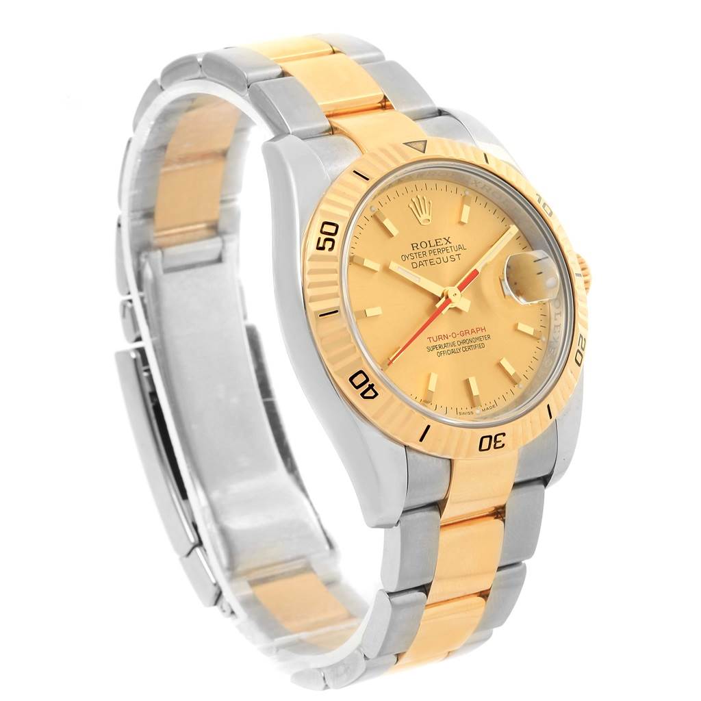 The image shows a Rolex Turn-o-Graph 116263 Men
s Stainless Steel Champagne Dial 116263 Men
s Stainless Steel Champagne Dial watch from a side angle, highlighting its gold and silver bracelet, dial, and bezel.