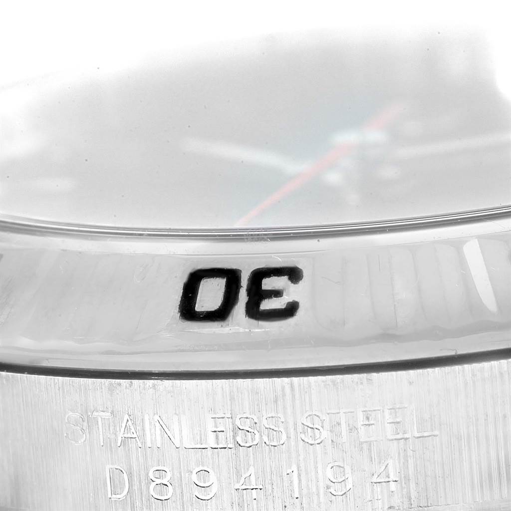 This image shows a close-up of the bezel and stainless steel case of a Rolex Turn-o-Graph 116264 Men's Stainless Steel Blue Dial 116264 Men's Stainless Steel Blue Dial watch.