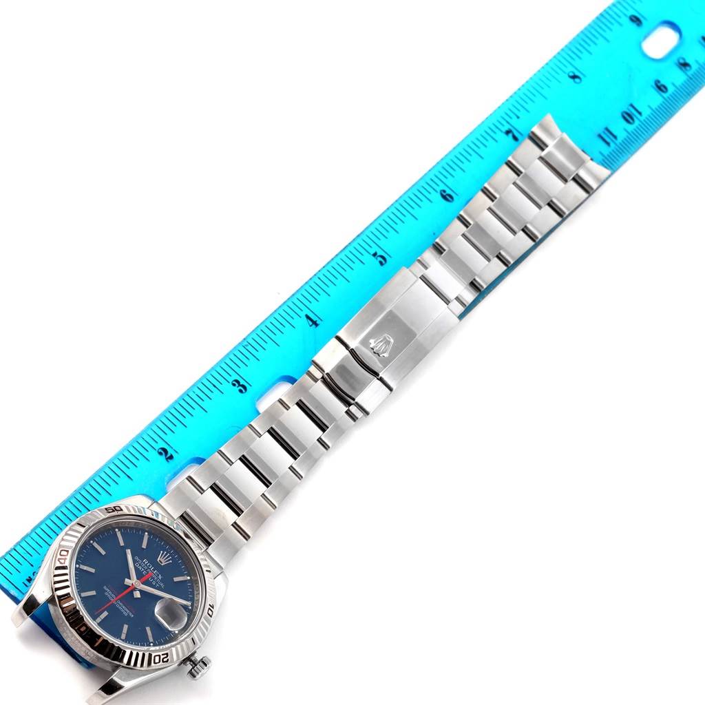 This image shows a Turn-o-Graph Rolex watch displayed horizontally, including the face, bezel, bracelet, and a blue measuring ruler.