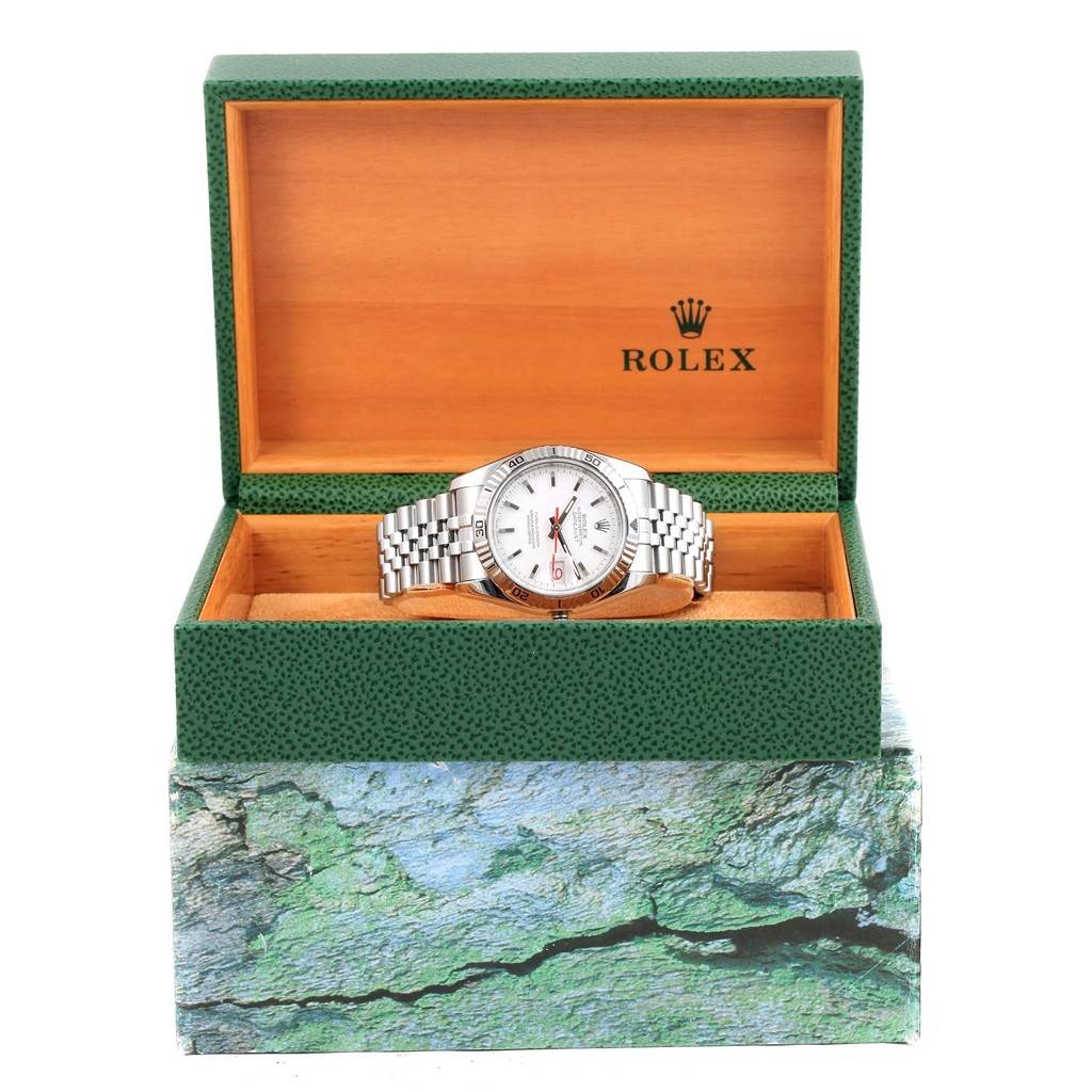 The image shows a Rolex Turn-o-Graph 116264 Men
s Stainless Steel White Dial 116264 Men
s Stainless Steel White Dial watch with a silver bracelet, displayed in an open green and beige box.