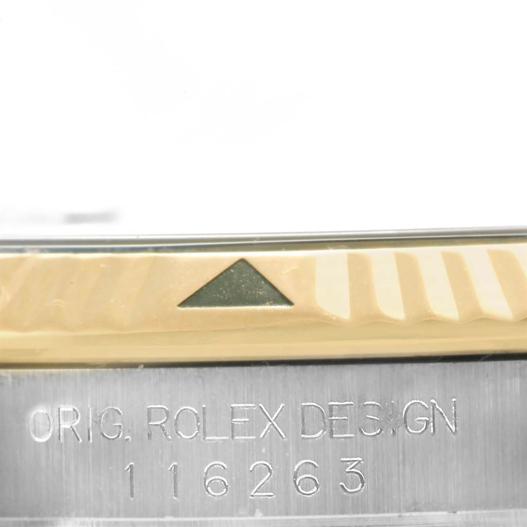 This image shows a close-up of the bezel and part of the case of the Rolex Turn-o-Graph 116263 Men's Steel and Gold (two tone) Grey Dial 116263 Men's Steel and Gold (two tone) Grey Dial model, with visible engraving.