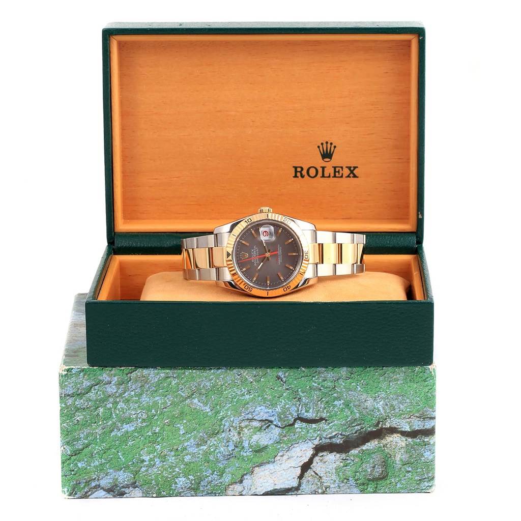 This image shows a Rolex Turn-o-Graph 116263 Men's Steel and Gold (two tone) Grey Dial 116263 Men's Steel and Gold (two tone) Grey Dial watch displayed frontally in an open green and orange box with the Rolex logo inside the lid.