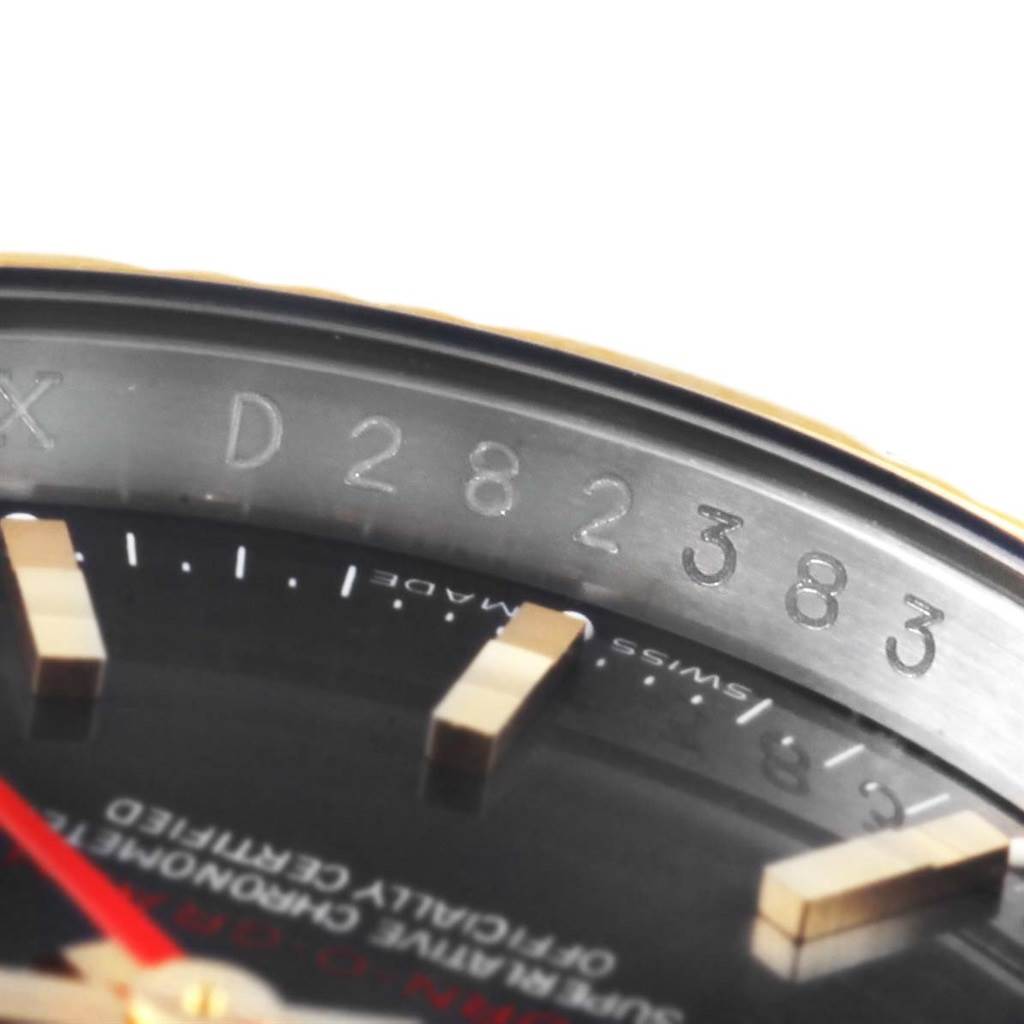 The image shows a close-up of the dial and serial number engraving on the bezel of the Rolex Turn-o-Graph 116263 Men's Steel and Gold (two tone) Grey Dial 116263 Men's Steel and Gold (two tone) Grey Dial watch.
