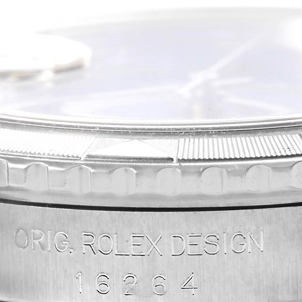 This image shows a close-up side view of the bezel and case of the Rolex Turn-o-Graph 16264 Men's Stainless Steel Blue Dial 16264 Men's Stainless Steel Blue Dial model watch, including its engraved design number.