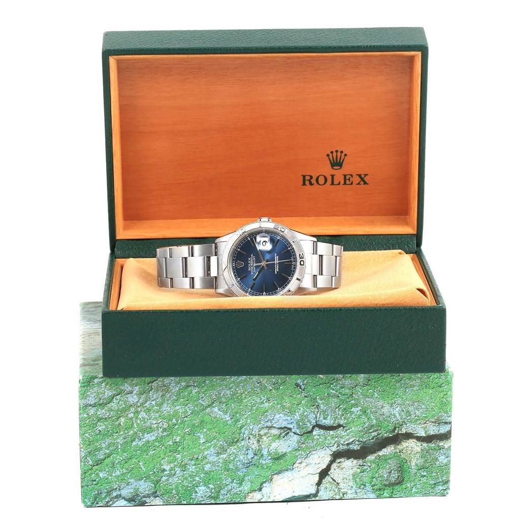 The Rolex Turn-o-Graph 16264 Men's Stainless Steel Blue Dial 16264 Men's Stainless Steel Blue Dial watch is displayed in its open green and wood box, showing a front view with the bracelet and dial visible.