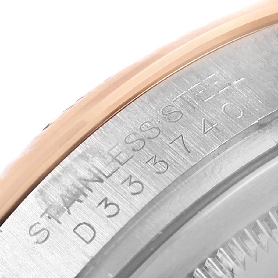 This close-up image of a Rolex Turn-o-Graph 116261 Men's Stainless Steel Silver Dial 116261 Men's Stainless Steel Silver Dial watch shows part of the stainless steel case and engraved model details.