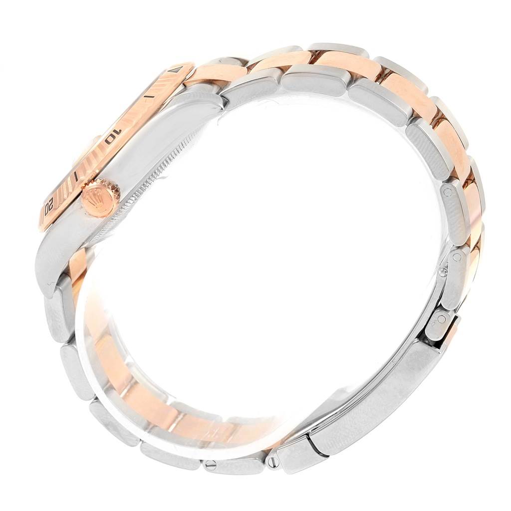 The image shows the side view of a Rolex Turn-o-Graph 116261 Men's Stainless Steel Silver Dial 116261 Men's Stainless Steel Silver Dial watch, highlighting its rose gold bezel, crown, and two-tone bracelet.