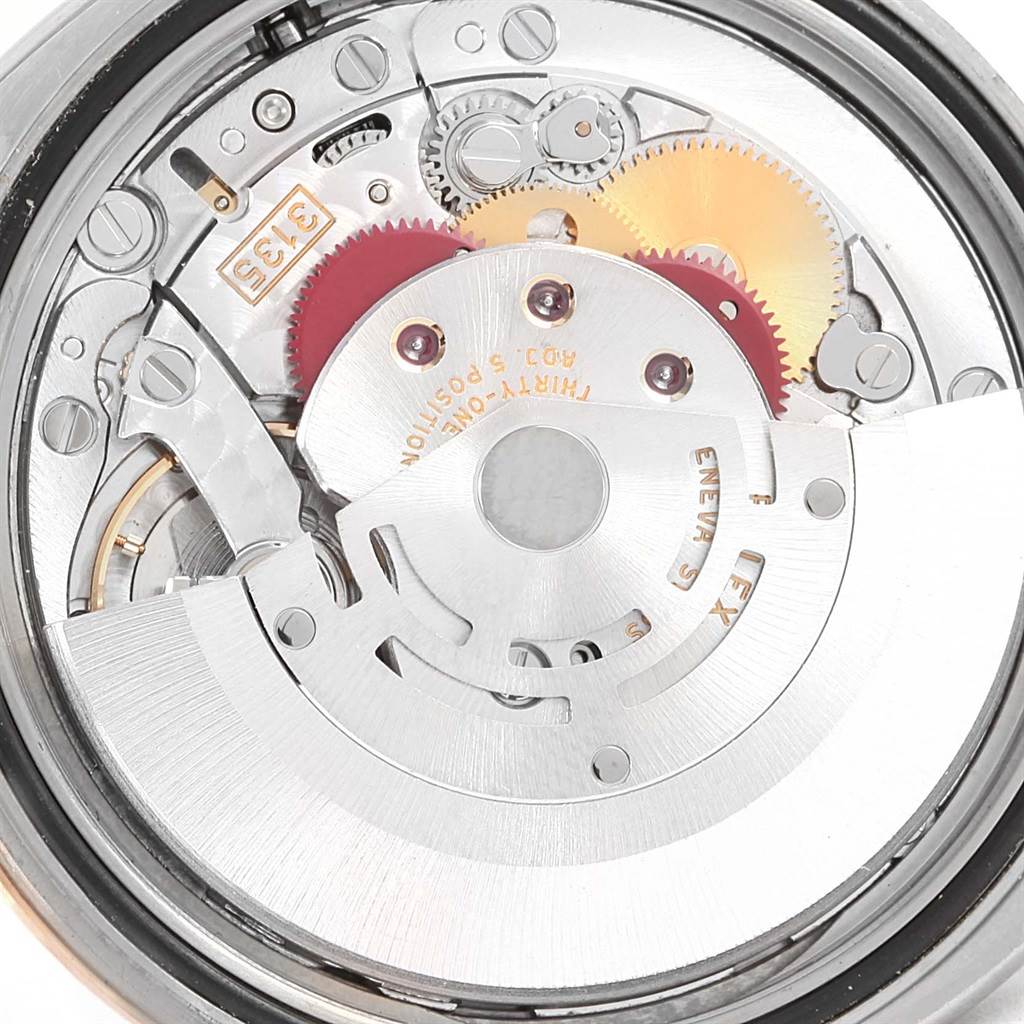 The image shows the intricate internal mechanism of the Rolex Turn-o-Graph 116261 Men's Stainless Steel Silver Dial 116261 Men's Stainless Steel Silver Dial watch viewed from a close-up angle.