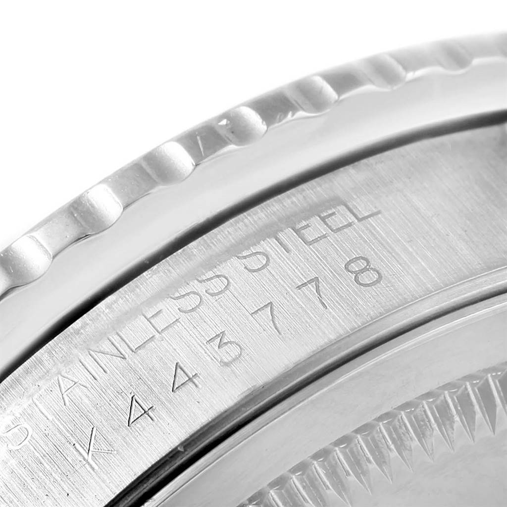 This image shows a close-up of the stainless steel bezel and case back of a Rolex Turn-o-Graph 16264 Men's Stainless Steel Silver Dial 16264 Men's Stainless Steel Silver Dial watch with engraved details.