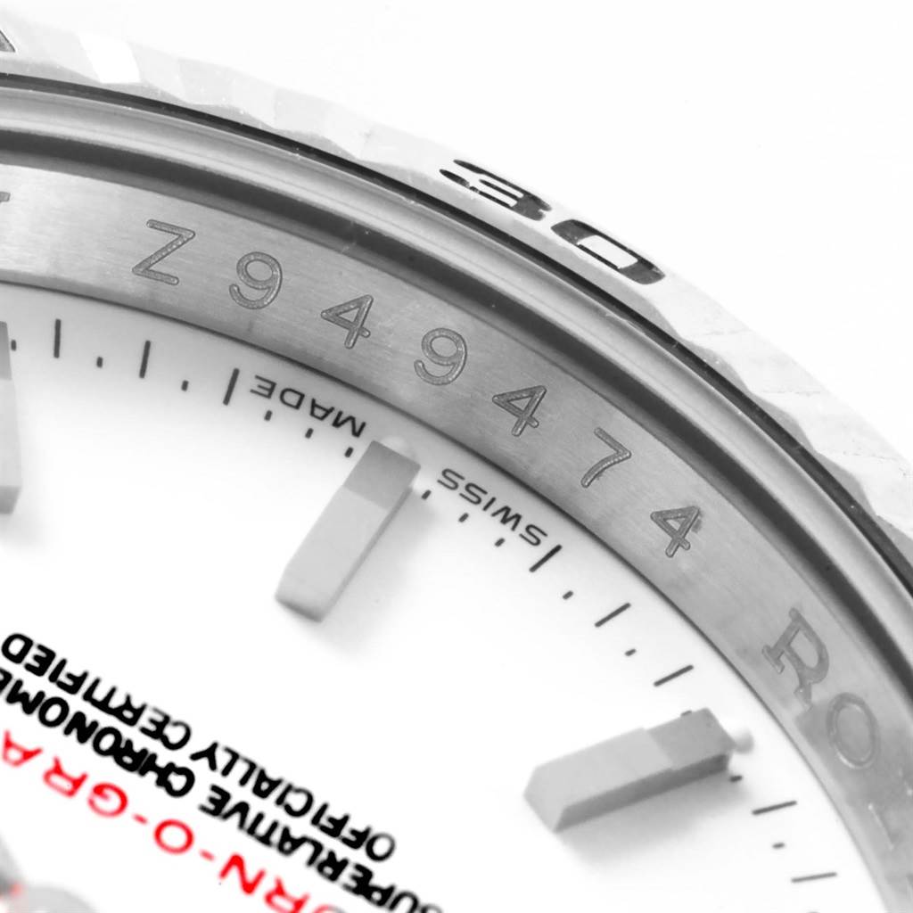 The image shows a close-up of the dial and bezel of a Rolex Turn-o-Graph 116264 Men
s Stainless Steel White Dial 116264 Men
s Stainless Steel White Dial watch, highlighting the serial number and part of the writing on the dial.