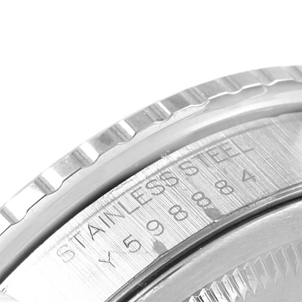 This image shows a close-up of the stainless steel caseback and fluted bezel of a Rolex Turn-o-Graph 16264 Men
s Stainless Steel Black Dial 16264 Men
s Stainless Steel Black Dial watch.