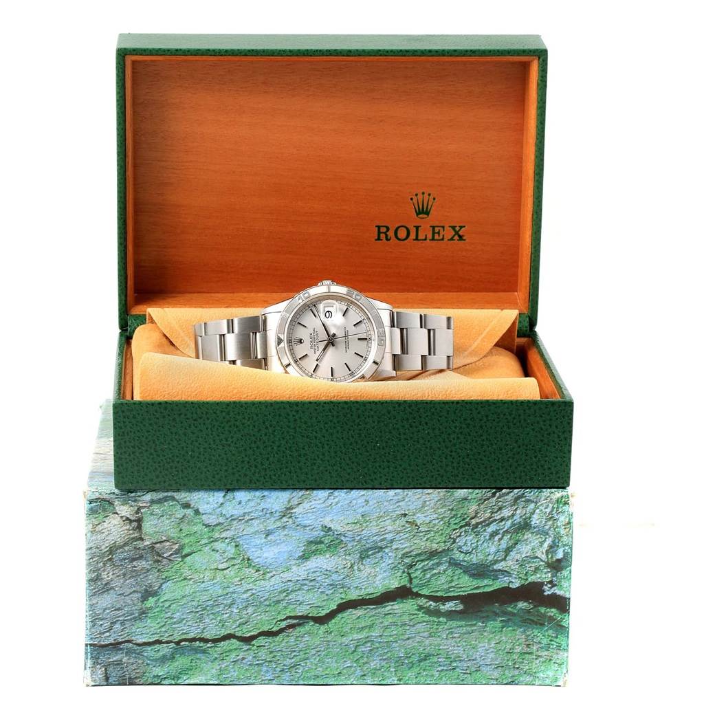 The Rolex Turn-o-Graph 16264 Men's Stainless Steel Silver Dial 16264 Men's Stainless Steel Silver Dial watch is displayed front-facing in its open green and wood packaging.