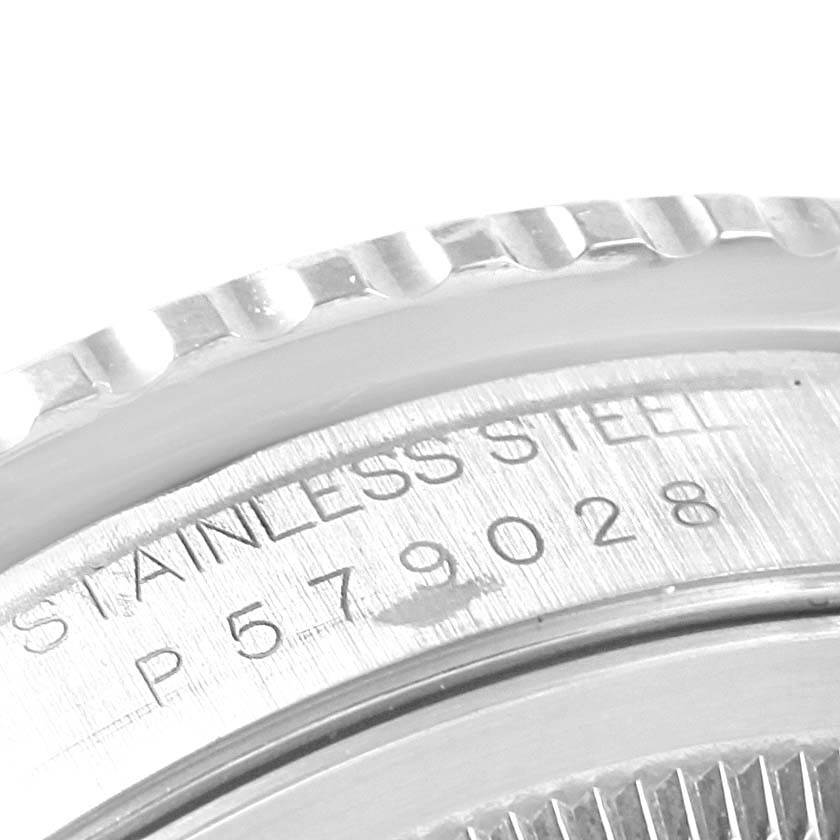 This image shows a close-up of the stainless steel case back and edge of the bezel on a Rolex Turn-o-Graph 16264 Men's Stainless Steel Black Dial 16264 Men's Stainless Steel Black Dial watch.